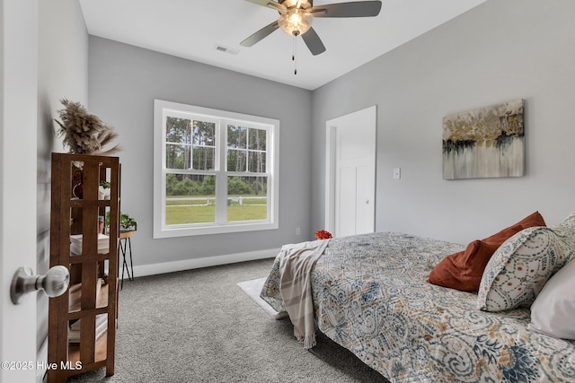 1399 Hammocks Beach Rd, Swansboro, NC 28584 - carpeted bedroom featuring baseboards and a ceiling fan