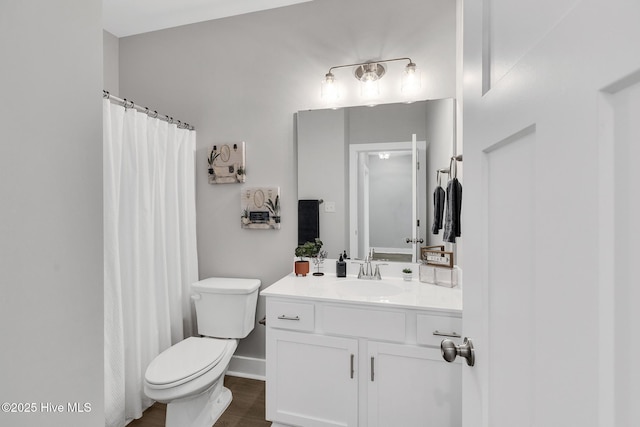 1399 Hammocks Beach Rd, Swansboro, NC 28584 - full bathroom featuring toilet, vanity, a shower with shower curtain, wood finished floors, and baseboards