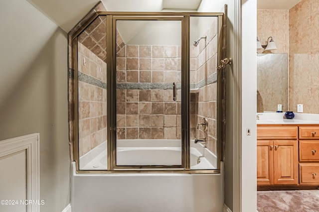 bathroom featuring vanity and enclosed tub / shower combo