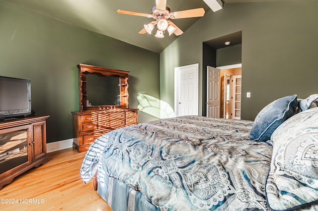 bedroom featuring lofted ceiling with beams, wood-type flooring, and ceiling fan