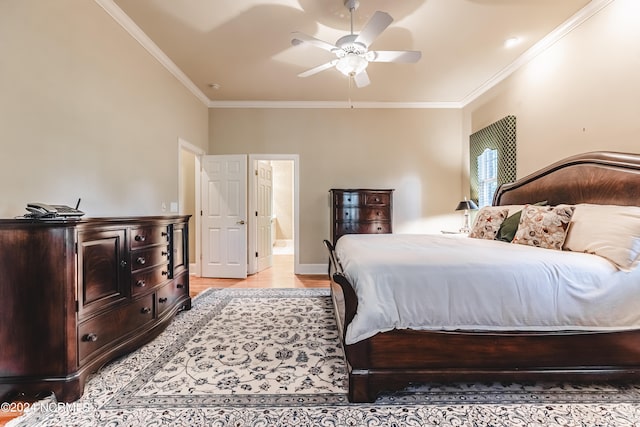 bedroom with light hardwood / wood-style floors, crown molding, ensuite bathroom, and ceiling fan