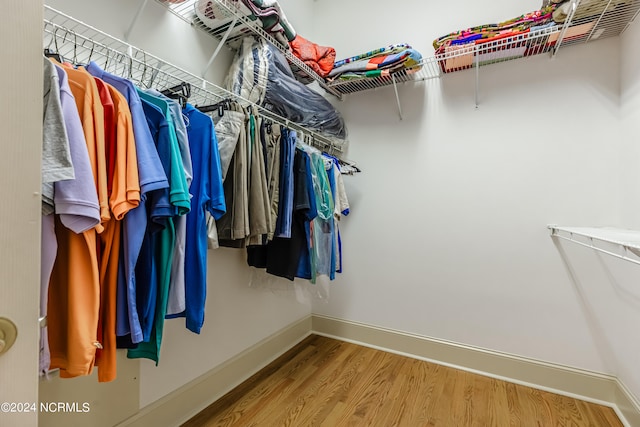 walk in closet featuring hardwood / wood-style floors