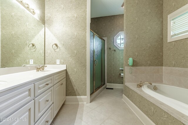 bathroom with vanity, separate shower and tub, and tile patterned flooring