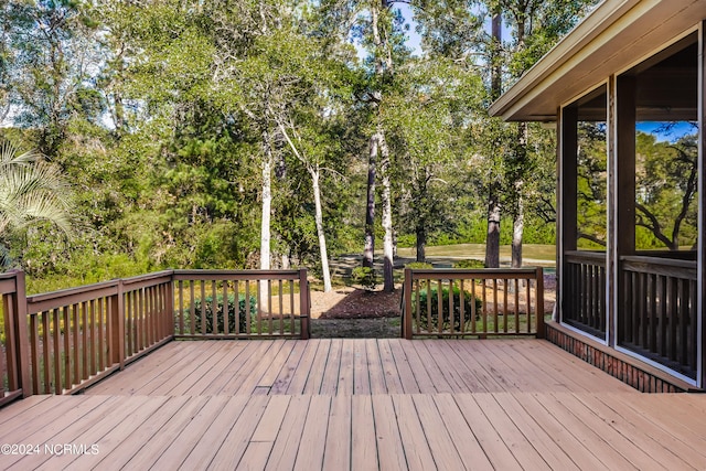 wooden terrace with a sunroom