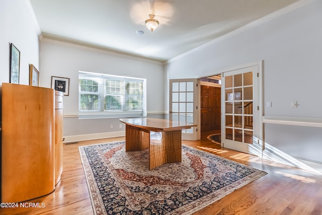 office area with ornamental molding, french doors, and light wood-type flooring