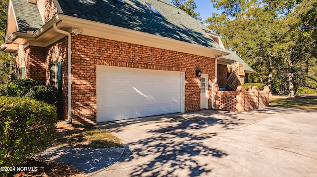 view of side of property featuring a garage