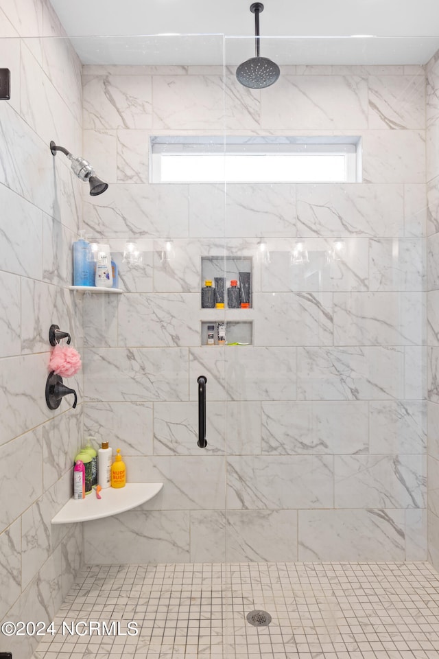 bathroom featuring walk in shower and a wealth of natural light