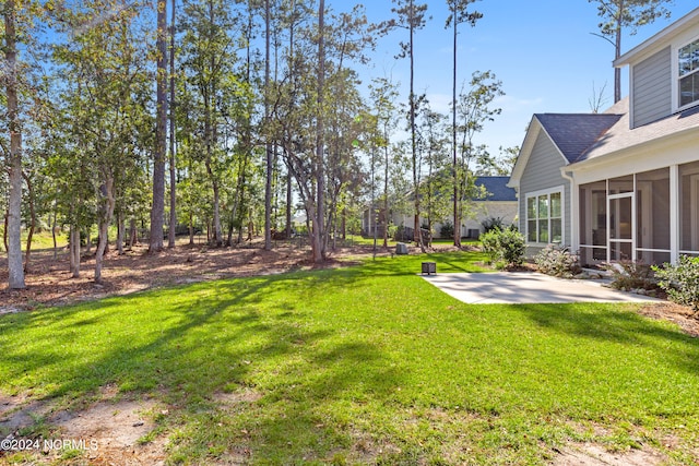 view of yard with a patio and a sunroom