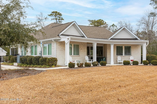 view of front of house featuring a front yard and a porch