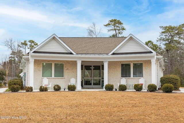 view of front of home with a front lawn and a porch