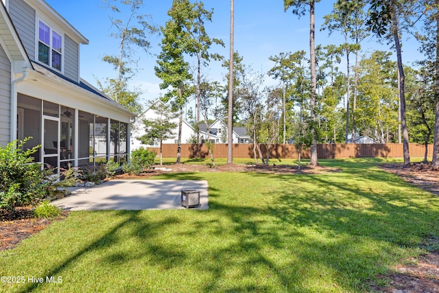 view of yard featuring a patio area and a sunroom