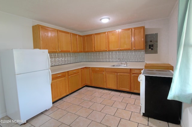 kitchen with sink, range, white fridge, decorative backsplash, and electric panel