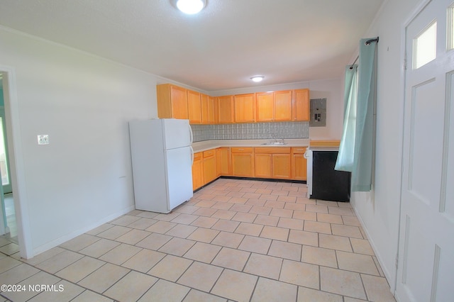 2989 Bird Dr SW, Shallotte, NC 28470 - kitchen with freestanding refrigerator, light countertops, light brown cabinetry, electric panel, and ornamental molding
