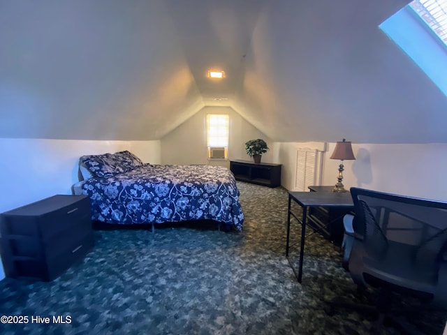 carpeted bedroom with vaulted ceiling with skylight