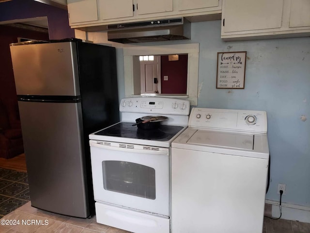 interior space featuring washer / dryer, cream cabinetry, stainless steel fridge, and electric stove