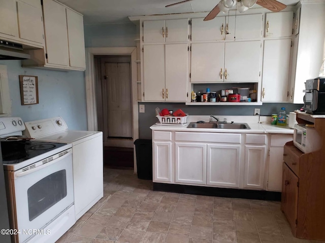 kitchen featuring white cabinets, sink, washer and clothes dryer, and ceiling fan