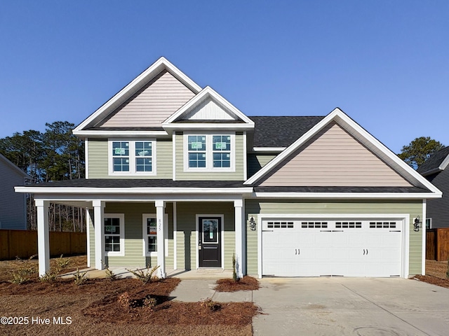 view of front of house with a garage and covered porch