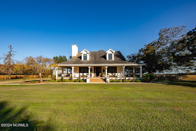 back of house with a porch and a yard