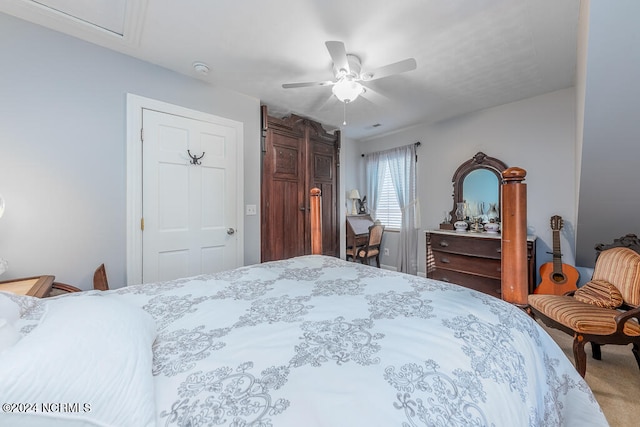 bedroom with ceiling fan and carpet flooring