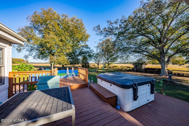 wooden terrace with a hot tub