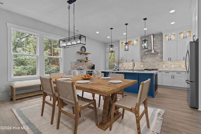 dining room featuring light hardwood / wood-style flooring and sink