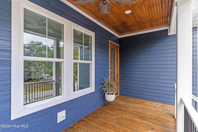 wooden deck featuring ceiling fan and a porch