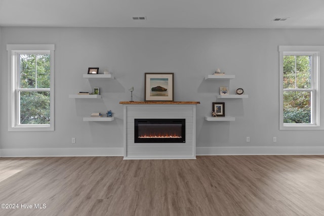 unfurnished living room featuring light wood-type flooring