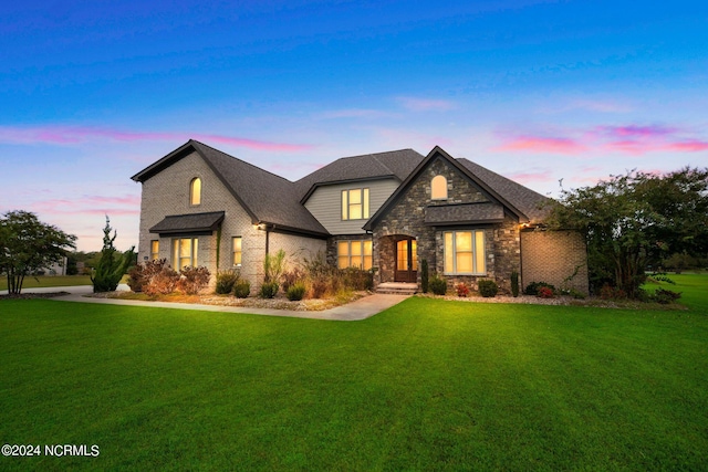 view of front of home with a yard