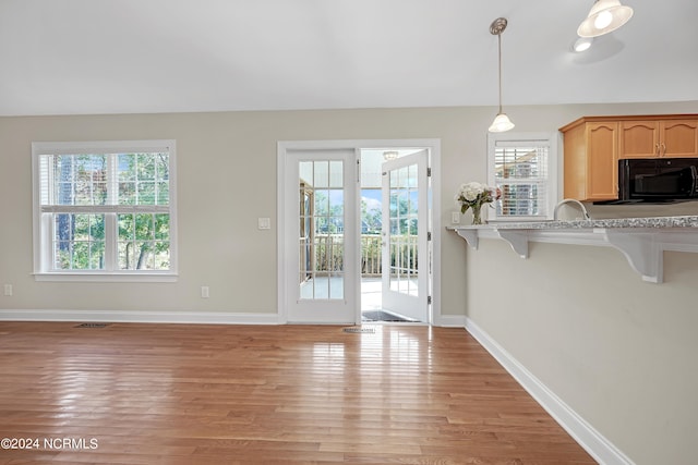 entryway with light hardwood / wood-style floors