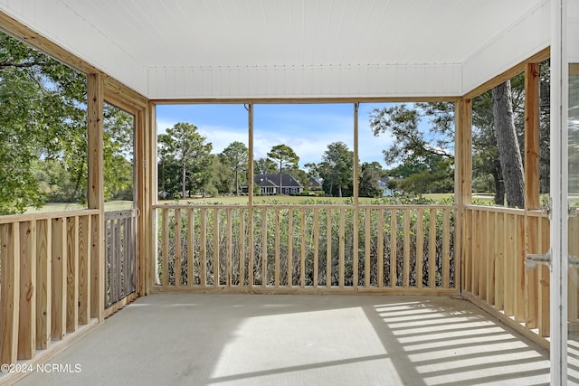 unfurnished sunroom featuring a wealth of natural light