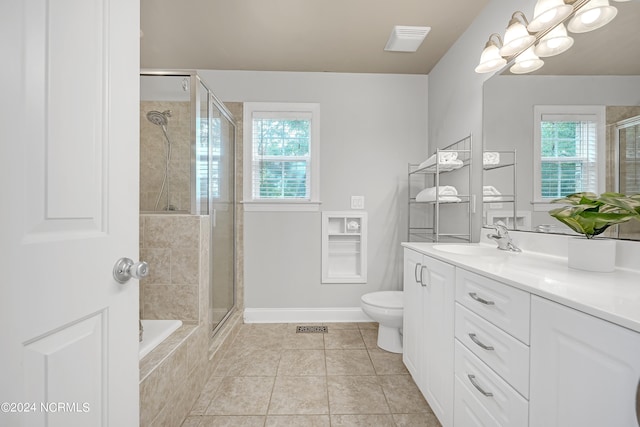 full bathroom featuring vanity, toilet, tile patterned floors, and separate shower and tub