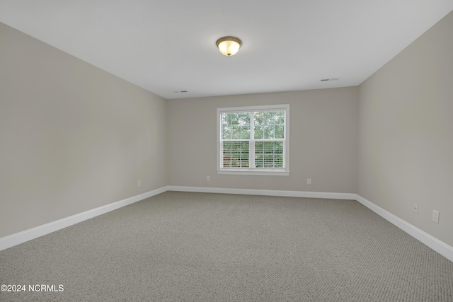 spare room featuring carpet floors