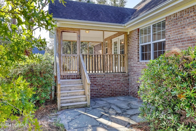 doorway to property with covered porch