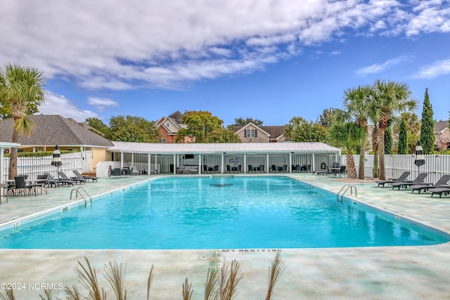 view of swimming pool with a patio area