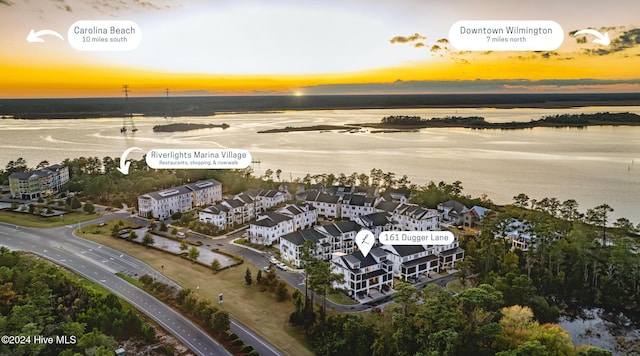 aerial view at dusk with a water view