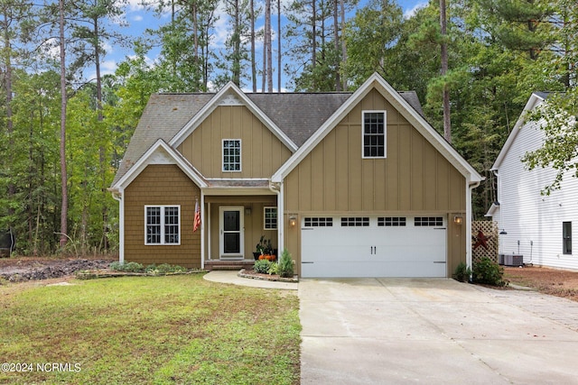 view of front facade featuring board and batten siding, concrete driveway, an attached garage, and central AC unit