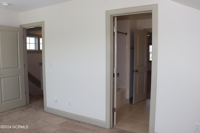 236 Trisail Ter, Wilmington, NC 28412 - unfurnished bedroom featuring baseboards, light colored carpet, and a spacious closet