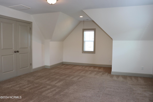 236 Trisail Ter, Wilmington, NC 28412 - additional living space with carpet floors, baseboards, visible vents, and vaulted ceiling