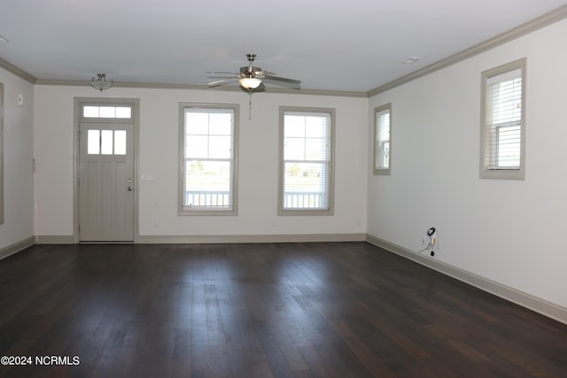 entrance foyer featuring ornamental molding, ceiling fan, and dark wood-type flooring