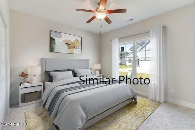 carpeted bedroom with ceiling fan