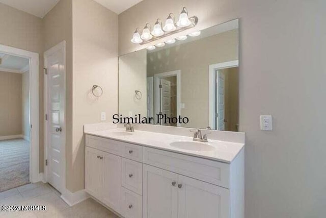 1397 Hammocks Beach Rd, Swansboro, NC 28584 - bathroom featuring double vanity, tile patterned flooring, and baseboards