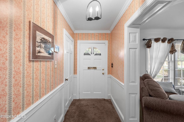 entryway with crown molding and carpet floors