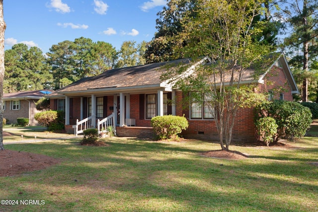 1008 S Howard Cir, Tarboro, NC 27886 - ranch-style house with crawl space, brick siding, a front lawn, and covered porch