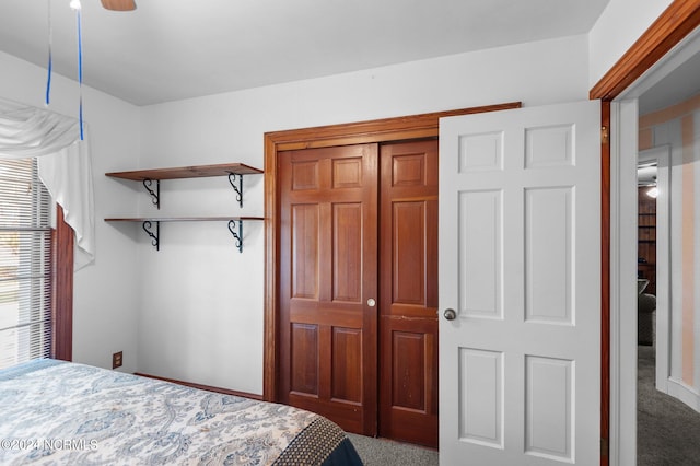 bedroom with ceiling fan and carpet flooring