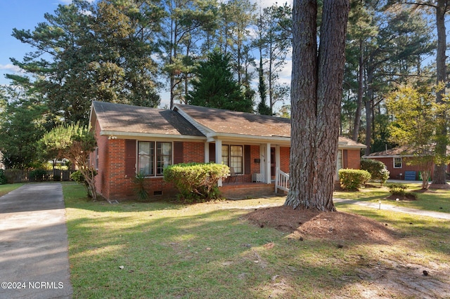 single story home with a front yard and a porch