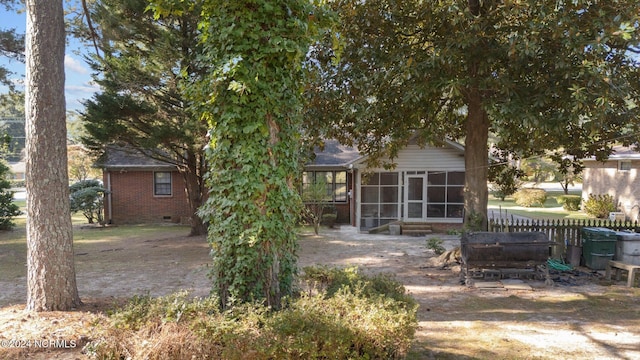 1008 S Howard Cir, Tarboro, NC 27886 - rear view of house with a sunroom, crawl space, and brick siding