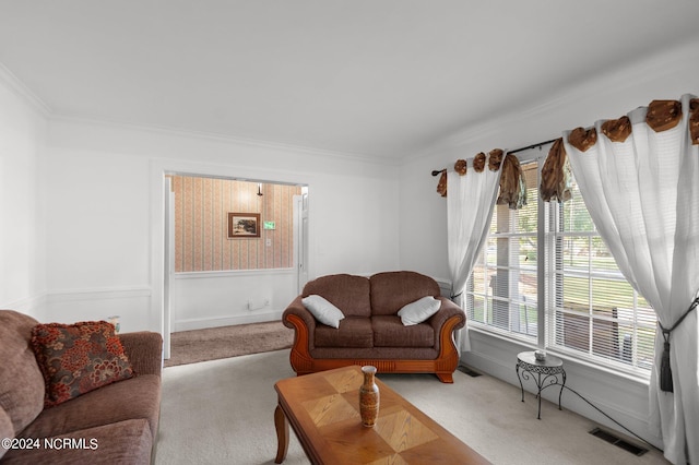 carpeted living room featuring crown molding