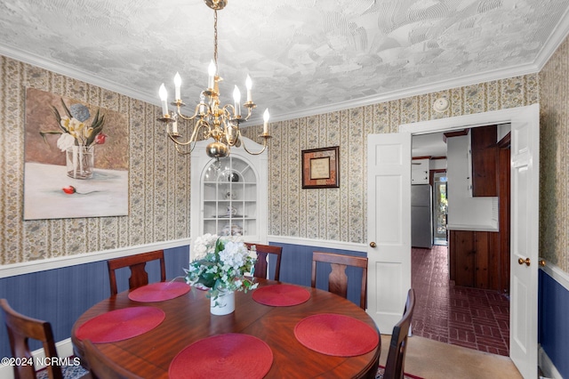 1008 S Howard Cir, Tarboro, NC 27886 - dining room with a wainscoted wall, a chandelier, and wallpapered walls