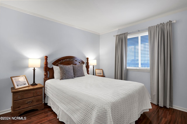 bedroom featuring dark hardwood / wood-style floors and crown molding