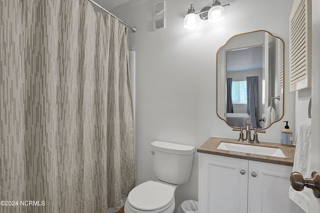 bathroom with a shower with curtain, vanity, and toilet